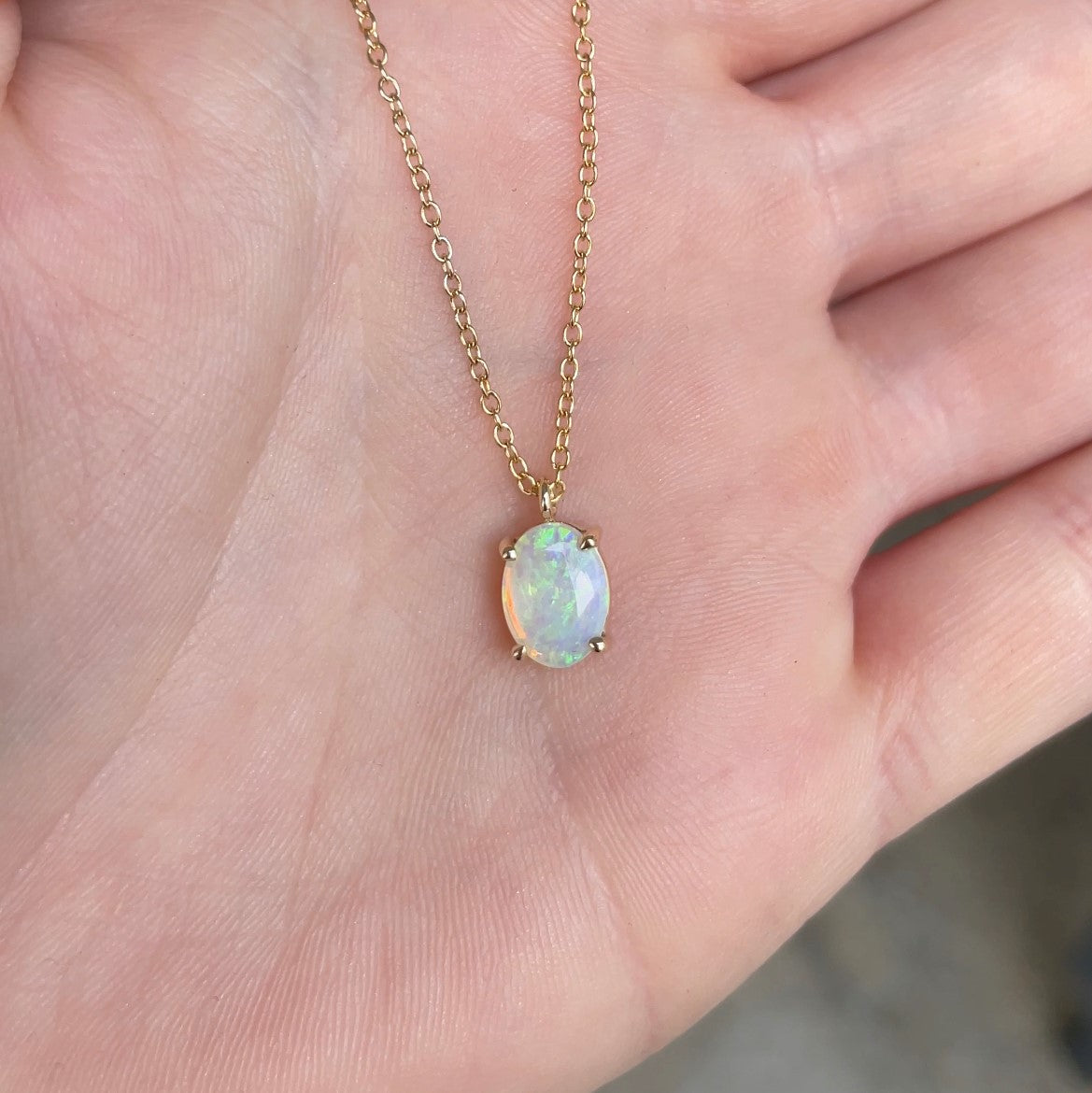 Here is a boulder opal necklace with champagne diamond accents.